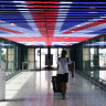 More open for business: a traveller at Terminal 5 in London Heathrow Airport.