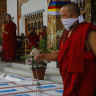 Monks perform a ritual as 500,000 doses of Moderna COVID-19 vaccine gifted from the United States arrived at Paro International Airport in Bhutan on July 12.