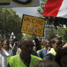 A protestor holds a sign which reads “vaccine to freedom” during a demonstration in Paris on Saturday.