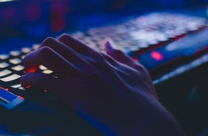 Person typing on computer keyboard