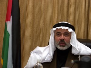 File - Palestinian Prime Minister Ismail Haniyeh listens to his ministers during a cabinet meeting in Gaza January 16, 2007. 