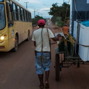 Searching for sustenance: In Para State, a man moves his furniture in a cart after struggling to make rent following food price inflation beginning in 2013. Credit Lalo de Almeida/Folhapress/Panos