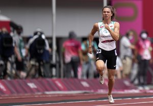 Krystsina Tsimanouskaya, of Belarus, runs in the women's 100-meter run at the 2020 Summer Olympics, Friday, July 30, 2021. Tsimanouskaya alleged her Olympic team tried to remove her from Japan in a dispute that led to a standoff Sunday, Aug. 1, at Tokyo’s main airport.