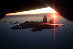 File - A U.S. Air Force KC-135 Stratotanker assigned to the 340th Expeditionary Air Refueling Squadron, Al Udeid Air Base, Qatar, refuels a Navy F/A-18E/F Super Hornet assigned to the USS Theodore Roosevelt over the skies of Afghanistan Dec. 7, 2017.