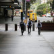 Police patrol empty streets during Brisbane’s lockdown, the strictest of the pandemic so far.