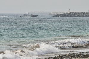 An Emirati Coast Guard vessel patrols off Fujairah, United Arab Emirates, Wednesday, Aug. 4, 2021