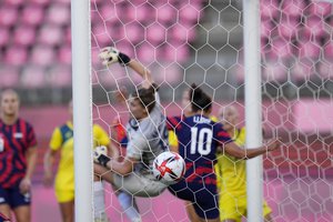 The ball hits the net after United States' Megan Rapinoe scored the opening goal from a corner kick during the women's bronze medal soccer match against Australia at the 2020 Summer Olympics, Thursday, Aug. 5, 2021, in Kashima, Japan