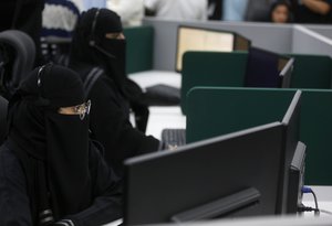 Saudi police officers receive calls at an emergency call center, ahead of the Hajj pilgrimage in the Muslim holy city of Mecca, Saudi Arabia