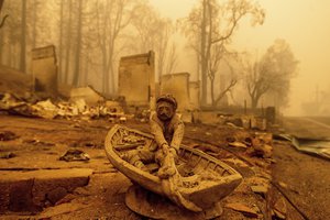 An ornament rests in front of a Greenville home destroyed by the Dixie Fire in Plumas County, Calif., on Friday, Aug. 6, 2021