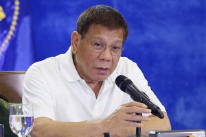 In this Feb. 15, 2021 file photo provided by the Malacanang Presidential Photographers Division, Philippine President Rodrigo Duterte gestures as he meets members of the Inter-Agency Task Force on the Emerging Infectious Diseases in Davao city, southern Philippines.