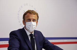 French President Emmanuel Macron attends a Defense Council at the Fort de Bregancon in Bormes-les-Mimosas, southern France Wednesday Aug. 11, 2021.