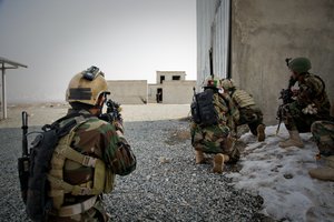 Afghan soldiers practice clearing a compound during a company-wide training exercise in Kabul province, Feb. 13, 2013