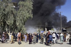 Smoke rises after fighting between the Taliban and Afghan security personnel, in Kandahar, southwest of Kabul, Afghanistan, Thursday, Aug. 12, 2021.