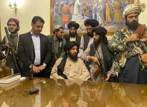 Taliban fighters take control of Afghan presidential palace after the Afghan President Ashraf Ghani fled the country, in Kabul, Afghanistan, Sunday, Aug. 15, 2021.