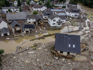 In this July 15, 2021 file photo destroyed houses are seen close to the Ahr river in Schuld, Germany