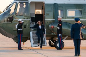 File - Vice President Kamala Harris salutes U.S. Marines as she disembarks Marine Two at Joint Base Andrews, Maryland, Friday, June 25, 2021, to begin her trip to El Paso, Texas.