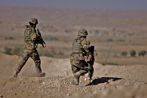 Soldiers from the 2nd Brigade, 215th Corps respond to a Taliban attack in Sangin, Helmand province, Afghanistan