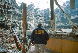 A U.S. Customs Agent surveys the damage inside the Customhouse in NYC following the Sept. 11 terrorist attack.