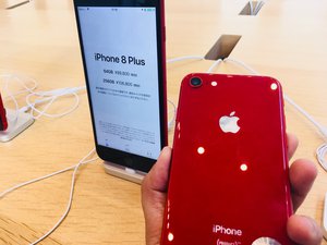 Shiny red iPhone 8 Plus smartphone at an Apple store in Tokyo, Japan. Taken on July 2018.