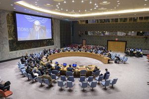 A wide view of the Security Council meeting as Ghassan Salame (on screen) briefs the Council on the situation in Libya