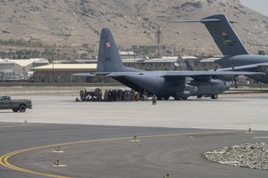 U.S. Department of Defense service members defend aircraft at Hamid Karzai International Airport (HKIA), in support of Operation Allies Refuge in Kabul, Afghanistan, Aug. 17, 2021.