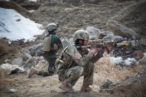 Afghan soldiers provide security during a company-wide training exercise in Kabul province, Feb. 13, 2013