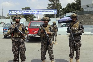 Taliban special forces fighters stand guard outside the Hamid Karzai International Airport after the U.S. military's withdrawal, in Kabul, Afghanistan, Tuesday, Aug. 31, 2021