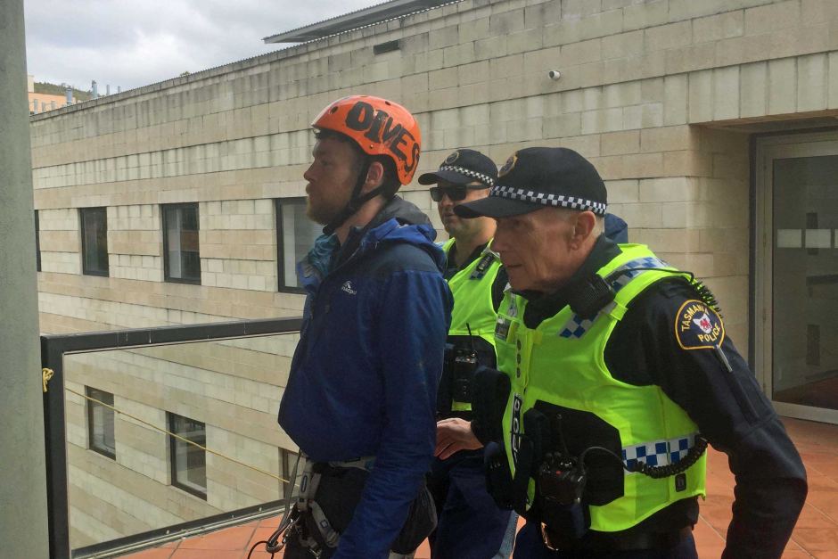 Rooftop protester Brodie Jeavons arrested by Tasmania Police