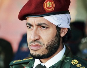 In this undated file photo made available on Sunday Sept. 25, 2011, al-Saadi Gadhafi, son of the late Libyan leader Moammar Gadhafi, watches a military exercise by the elite military unit commanded by his brother, Khamis, in Zlitan, Libya.