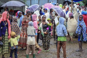 Displaced Amharas from different villages now controlled by Tigrayan forces in the North Gondar zone, gather in a kindergarten school housing the internally-displaced, in Debark, in the Amhara region of northern Ethiopia Wednesday, Aug. 25, 2021.