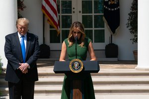 First Lady Melania Trump, joined onstage by President Donald J. Trump, delivers a prayer to open the National Day of Prayer service Thursday, May 2, 2019, in the Rose Garden of the White House