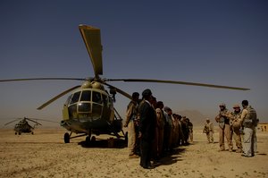 U.S. Air Force Master Sgt. Eric Marshall briefs Afghan National Air Corps airmen on how to fire a PKM general purpose machine gun from an Mi-17 Hip helicopter at the Kabul Military Training Center in Kabul, Afghanistan, May 12, 2008. Marshall is assigned to the Combined Air Power Transition Force and is deployed from the 18th Air Maintenance Squadron, Kadena Air Force Base, Japan. (U.S. Air Force photo by Master Sgt. Andy Dunaway/Released)   