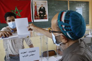 A man casts his ballot inside a polling station in Casablanca, Morocco, Wednesday, Sep 8, 2021.