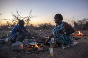 Tigray women who fled the conflict in Ethiopia's Tigray region, cook at Umm Rakouba refugee camp in Qadarif, eastern Sudan, Wednesday, Nov. 25, 2020