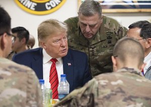 Donald J. Trump and Army Gen. Mark A. Milley, chairman of the Joint Chiefs of Staff, meet with service members at Bagram Airfield