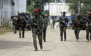 Guinean soldiers patrol outside the Presidential palace in Conakry, Guinea Friday, Sept. 10, 2021