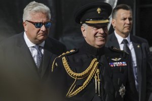 File - Belgian Prince Laurent, left, and Britain's Prince Andrew, the Duke of York, center, attend a memorial ceremony to mark the 75th anniversary of the liberation from German occupation in Bruges, Belgium, Saturday, Sept. 7, 2019.