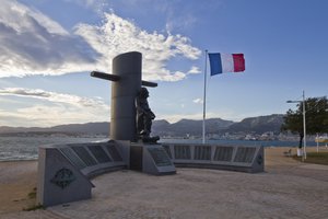 Photograph of flag of France and Submarine National Monument in Provence-Alpes-Côte d'Azur, France