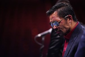 Manny Pacquiao, of the Philippines, attends a news conference after his loss to Yordenis Ugas, of Cuba, in a welterweight championship boxing match Saturday, Aug. 21, 2021, in Las Vegas