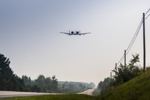 An A-10 Thunderbolt II from Selfridge Air National Guard Base, Michigan, takes off on a public highway in Alpena, Michigan, August 5, 2021