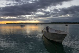 File - Sunset on the beach at Shangri-la resort, Yanuka Island, Fiji. As sea levels continue to rise, island peoples and cultures are being threatened by climate change.