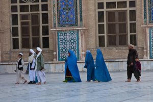 Daily life in Herat, man walks out mosque, Afghanistan