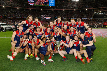 The Demons celebrate their grand final win.