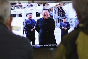 People watch a TV showing an image of North Korean leader Kim Jong Un during a news program at the Seoul Railway Station in Seoul, South Korea, Saturday, May 2, 2020.