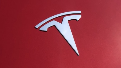 Tesla sets full-year sales record with three months to spare