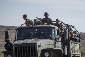 FILE - In this Saturday, May 8, 2021 file photo, Ethiopian government soldiers ride in the back of a truck on a road near Agula, north of Mekele, in the Tigray region of northern Ethiopia