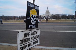 File - Pro-Trump signs are seen at the storming of the United States Capitol, Washington D.C., United States, 6 January, 2021. During the attack by supporters of President Donald Trump more than 140 people were injured, with five mortalities either shortly before, during, or after the event.