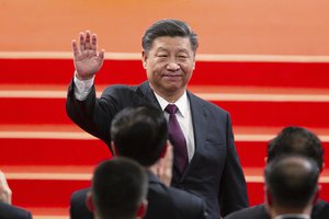 In this Dec. 20, 2019, file photo, Chinese President Xi Jinping waves during the inauguration ceremony in Macao to mark the 20th anniversary of the former Portuguese colony's handover to Chinese rule. China, Thursday, Sept. 3, 2020