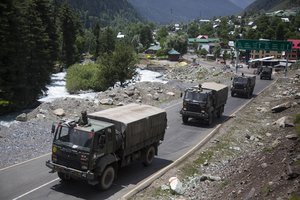 An Indian army convoy moves on the Srinagar- Ladakh highway at Gagangeer, north-east of Srinagar, India, Wednesday, June 17, 2020.