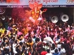 Devotees and volunteers at an immersion procession at Lalbaug in Mumbai on Sunday. (Satish Bate/HT Photo)